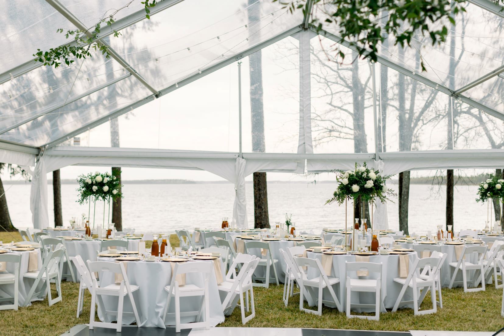 Wedding reception setup under tent.