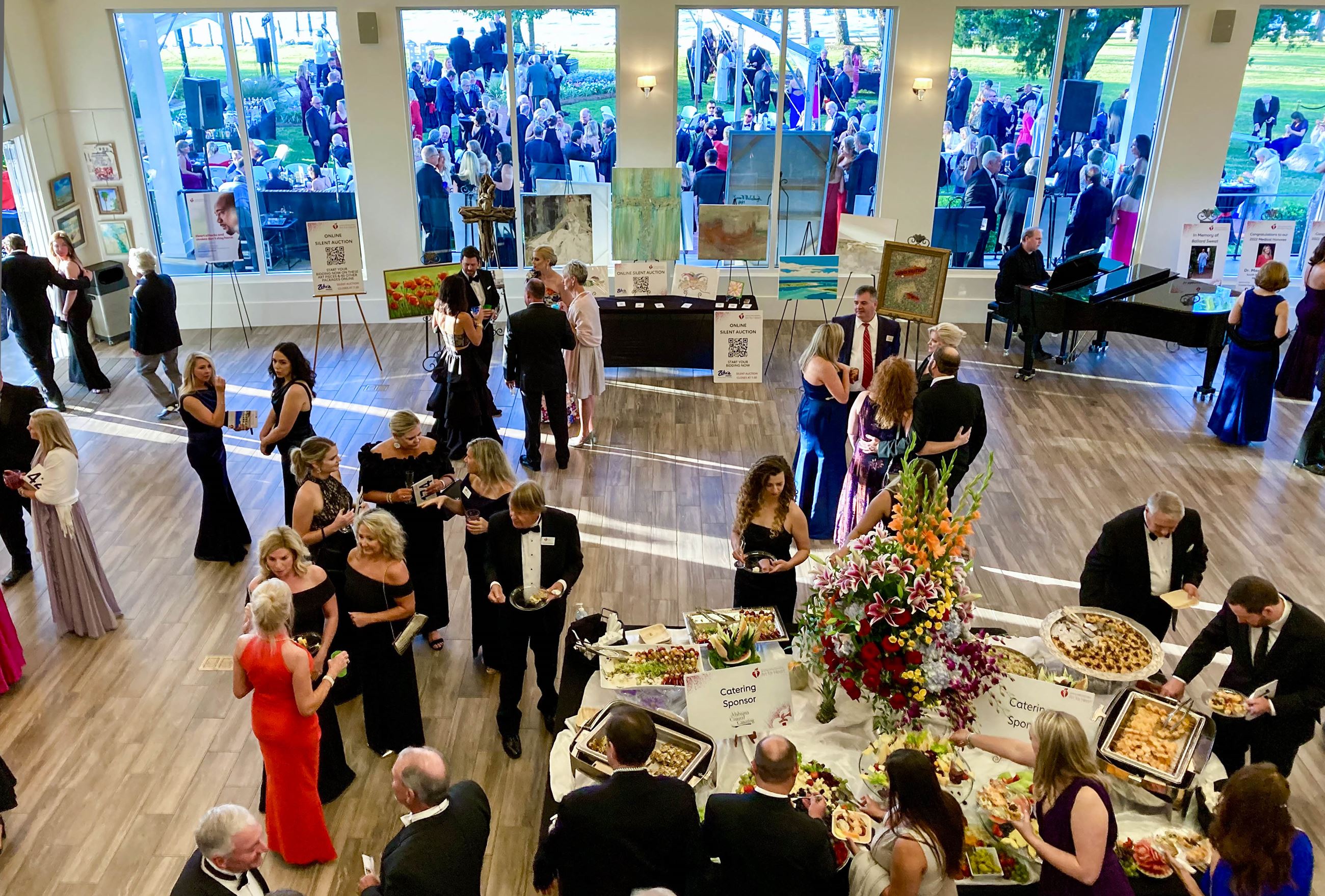 People getting food at event.