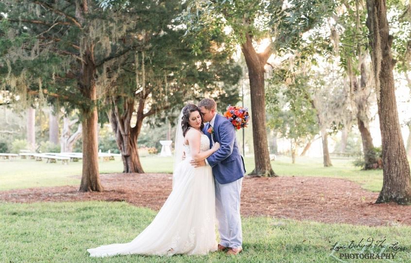 Bride and Groom Embrace in Spanish Moss-Covered Trees