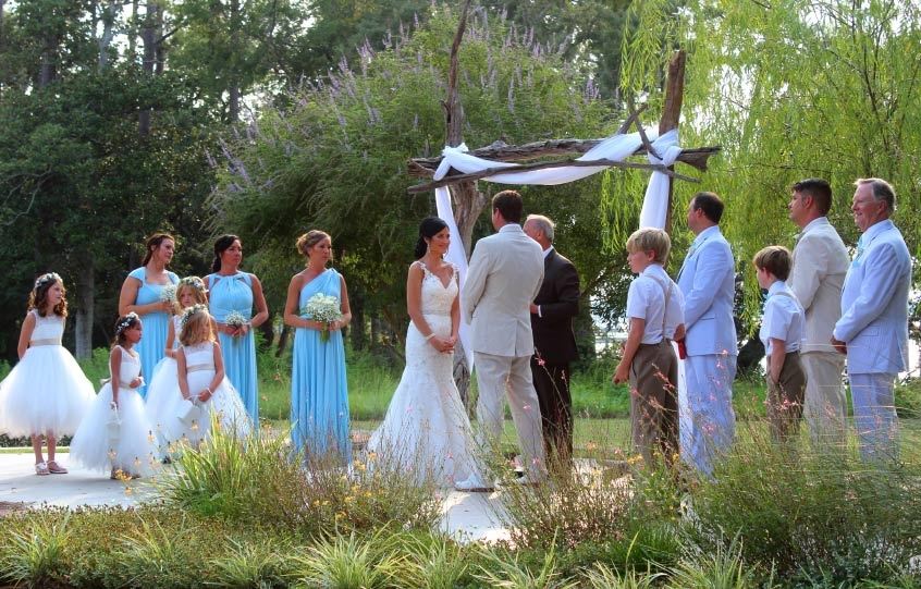Bride, Groom, and Wedding Party During Wedding Ceremony