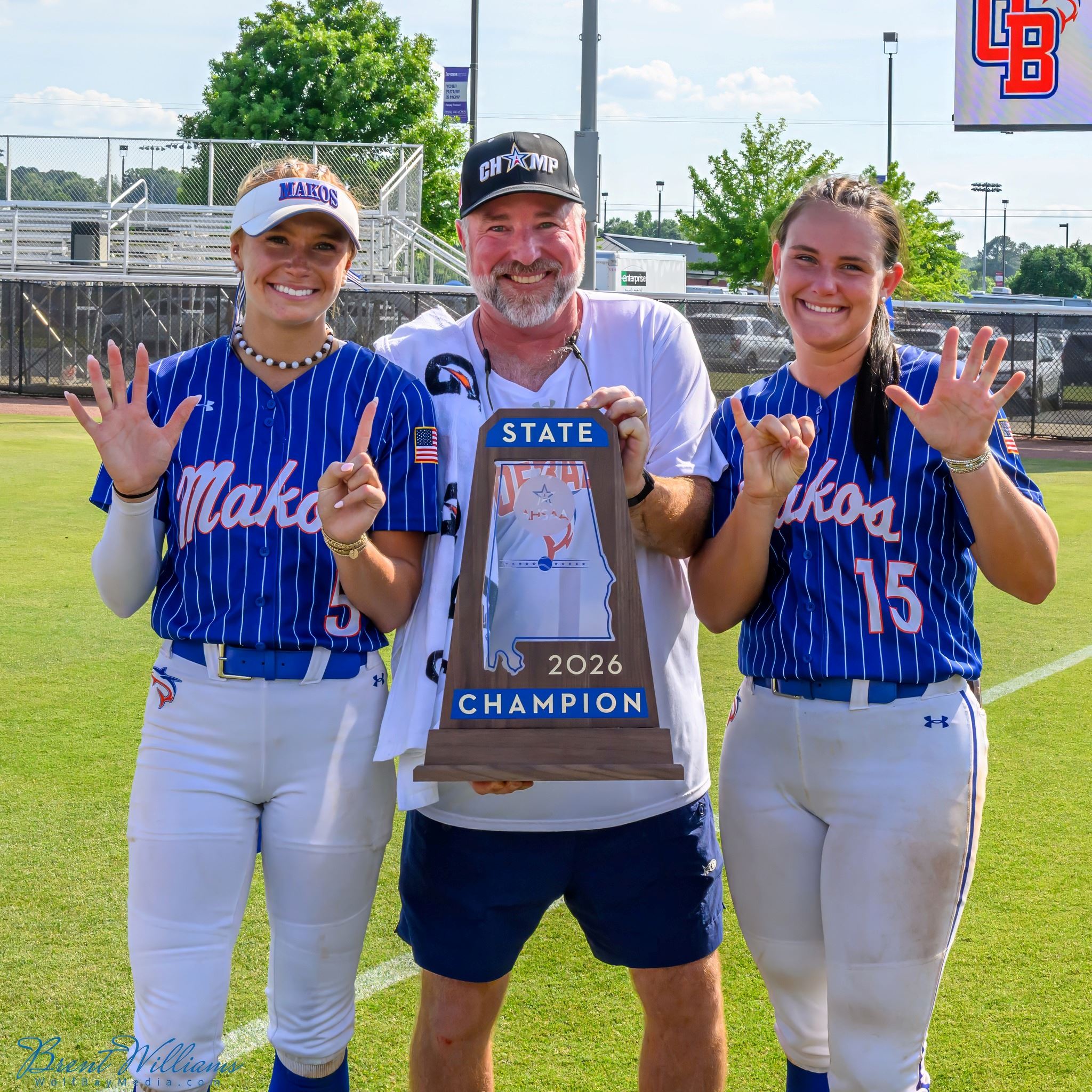 Orange Beach Head Softball Coach Shane Alexander with Teagan Revette and Ava Hodo