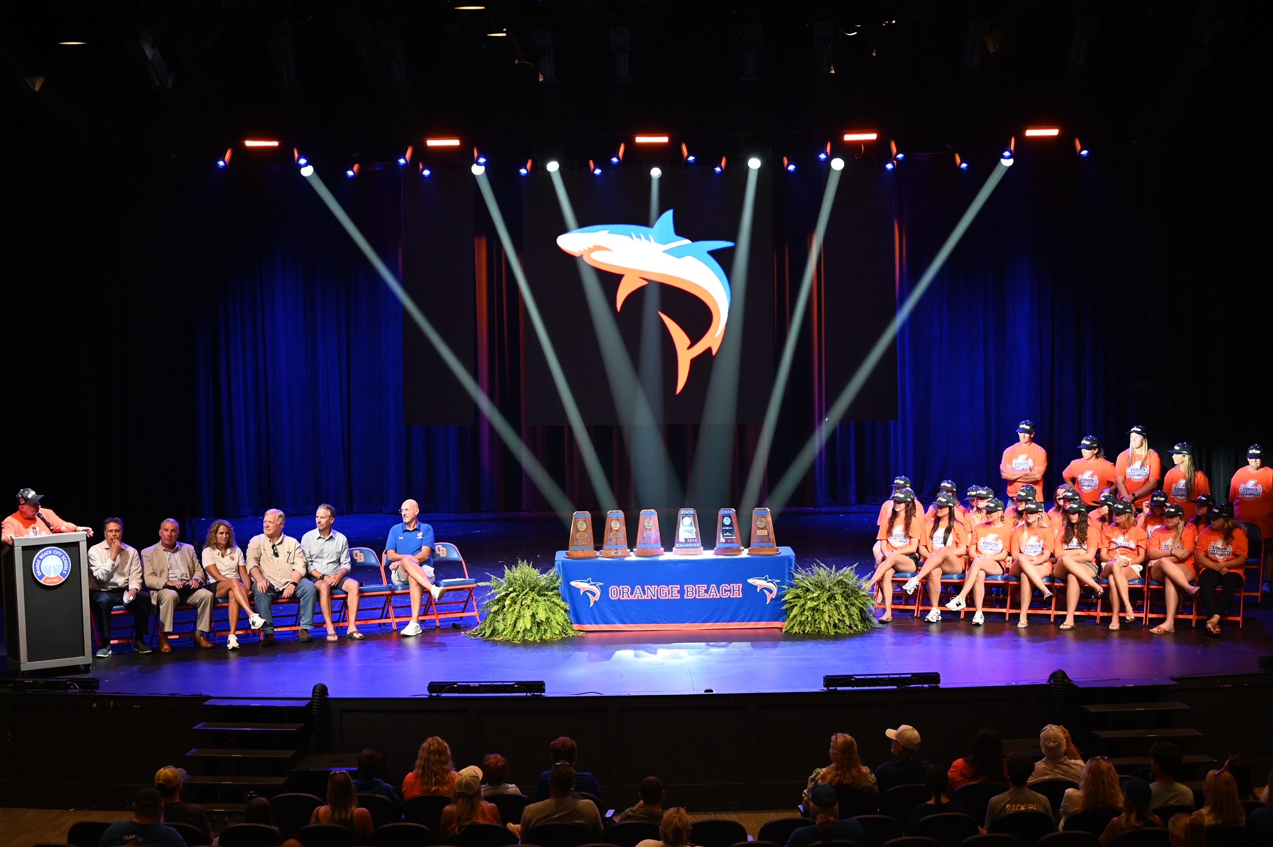 Mako Softball Team on the stage at the Orange Beach Performing Arts Center